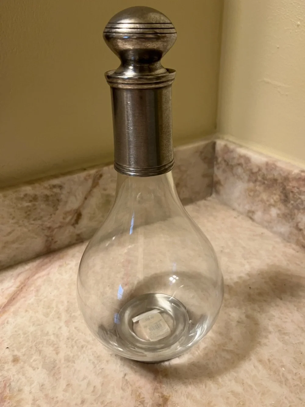 Glass decanter with pewter top